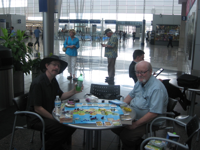 Last picture in my camera: Steve and Rick are sitting in the food court of the Indianapolis airport posing with the Catan map I got 3 nights earlier. While waiting for our plane back to Phoenix, the three of us played 3 Catan variants on it.  Kinda fun.  It's a pretty well-designed board for a small Catan game.