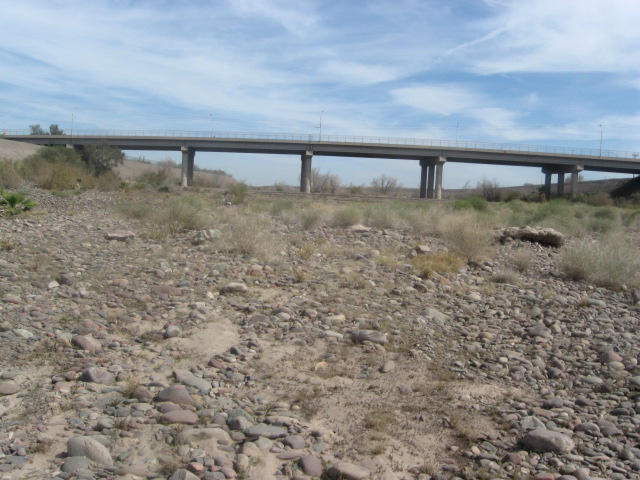 I started off next to the bridge, and now you can see that I'm about 1/4 of a mile west of it.  I have looked at millions of rocks and have found about 7 that I can use.