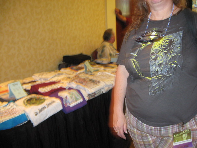 I was trying to take a picture of a table full of fannish t-shirts when a woman wearing a fannish t-shirt walked into it and blocked out half the picture.