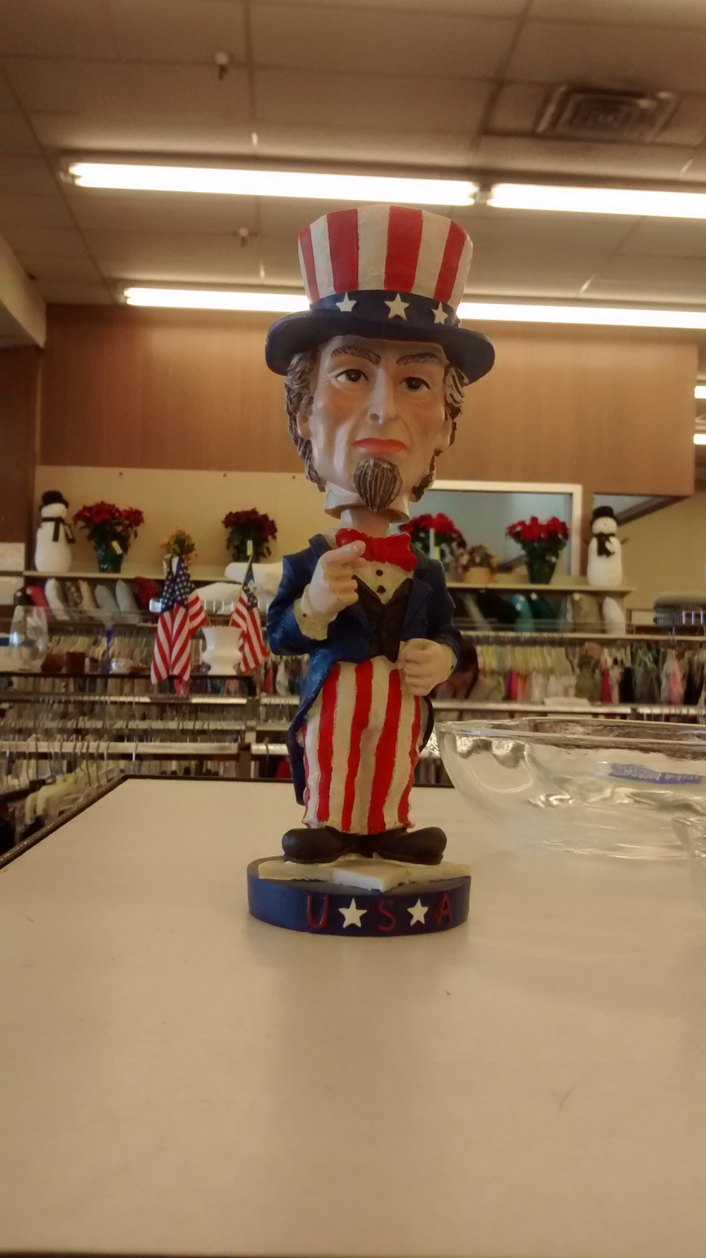 Porcelain bobble-head Uncle Sam. He reminds me of old pictures of President Andrew jackson.
